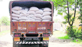 An unchecked loaded truck enters an FCI godown.