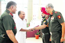 Army Chief General VK Singh introduces commanders to Defence Minister AK Antony at the Army Commanders Conference in New Delhi on Monday. 