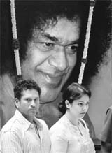 Sachin Tendulkar and wife Anjali at Prashanthi Nilayam in Puttaparthi to pay their last respects to Sathya Sai Baba on Monday.