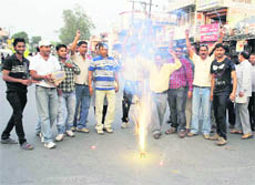 Supporters of Madhu Chauhan burst crackers to show their happiness over the court verdict at Vikasnagar in Dehradun district on Tuesday.