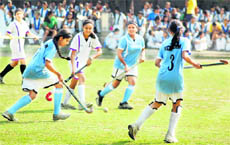 A match under way in the inter-school girls' hockey tournament played at Welham Girls' School in Dehradun on Tuesday. 