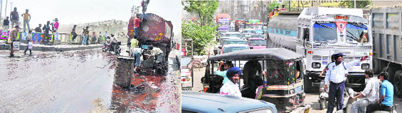 (Left) Molasses spilled on the citys busy Gill Road on Tuesday created problems for commuters, especially two-wheelers; and (right) it led to long queues of vehicles stuck in a traffic jam.