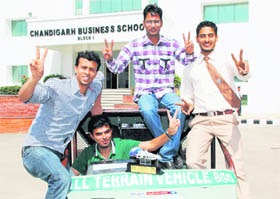 Students of Chandigarh Group of Colleges, Landran, with the vehicle that has won the first prize at a state-level competition.