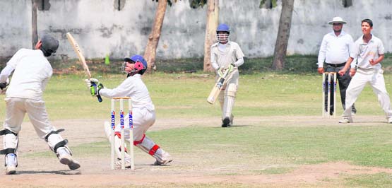 A batsman follows through a pull shot during a match between APJ XI and Coaching Centre-19 at Government Model Senior Secondary School, Sector 19, Chandigarh