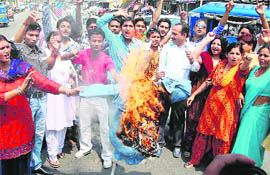 BJP activists stage a protest against the Congress-led UPA Central Government for failing to check corruption, in Haridwar on Wednesday.
