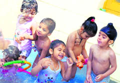 Tiny tots of Mothers Pride Pre-School enjoy during a rain dance party in Ludhiana on Wednesday
