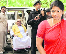 Tamil Nadu CM M Karunanidhi and his daughter and Rajya Sabha MP Kanimozhi arrive for a party meeting in Chennai on Wednesday.