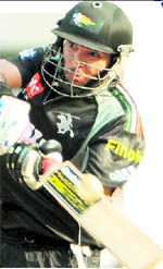 Pune Warriors Yuvraj Singh hits a boundary against Chennai Super Kings in Mumbai on Wednesday