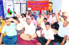 Village development officers stage a dharna at Roshanabad in Haridwar