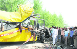 The mangled remains of the ill-fated bus after the accident on the Yamunanagar-Chhachhrauli road on Thursday