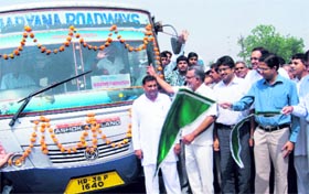 Deputy Commissioner Amit Aggarwal flags off the local bus service in Hisar.