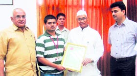 Jagannath Paharia, Haryana Governor, felicitates Gaurav Chugh at Murthal University. Vice-Chancellor HS Chahal (left) and chairman JS Rana (right) are also seen in the picture.