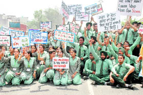 Students of Land Senior Secondary Public School, Jalandhar byepass, protest against setting up of a liquor vend in the schools vicinity in Ludhiana on Thursday. 