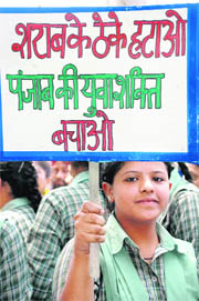 A student carries a placard during the protest