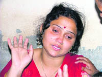 Kiran Singh mother of the four-year-old Manthan, grieves at her home. 