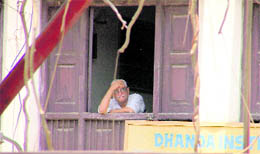 Fond memories: Lajpat Rai, an elderly resident near Lakkar Bridge, looks at the dismantling of the century-old bridge in Ludhiana on Thursday.