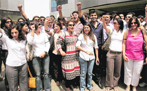 Air India employees raise slogans demanding pay hike and better working conditions in Mumbai on Thursday.