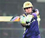Kolkata Knight Riders batsman Manoj Tiwary plays a shot during the match against Delhi Daredevils in New Delhi 