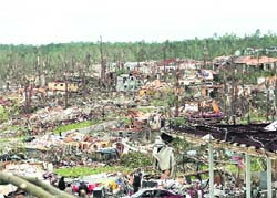 Tornadoes leave part of Pratt city, a suburb of Birmingham, Alabama, in ruins. At least 202 people were killed when dozens of deadly tornadoes, triggered by the storms of near-epic proportions wiped 
