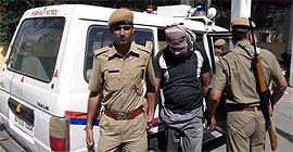 ISI agent Ismail Khan being taken to Jaipur by the Sriganganagar police on Friday.