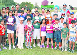 Winners and runners-up pose with their trophies after the conclusion of the Junior Putting Competition held at the CGA Golf Range 