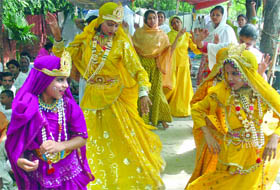 Girls dressed as Radha and Lord Krishna perform during a dharna held to save Yamuna at Jantar Mantar  in New Delhi on Friday. 