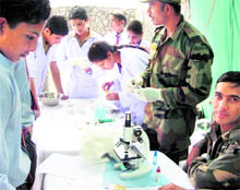 Students attend a blood group determination camp at Potha in Surankote on Friday