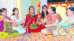 Students present a Dogri song during a function at the University of Jammu on Friday