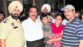 Kiran Singh (in red suit) with Abhijeet, alias Manthan, in a cheerful mood after the latter was rescued by the police on Thursday night in Ludhiana.