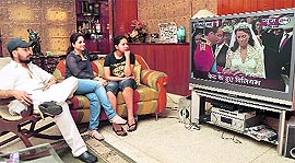 Tajeshwar Singh and family watches the royal wedding between Prince William and Kate Middleton in Ludhiana on Friday.