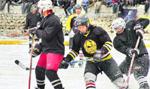 Players play ice hockey at a temporary rink in Ladakh. 