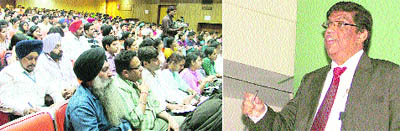 Dr Praful Vijakar (right) addresses doctors during a homeopathy seminar in Ludhiana on Saturday