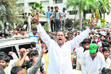 Majlis-e-Ittehadul Muslimeen party activists shout slogans against the attack on their leader Akbaruddin Owaisi in Hyderabad on Saturday