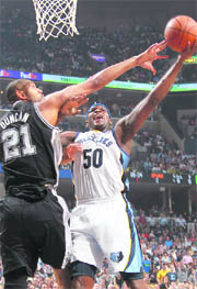 Memphis Grizzlies Zach Randolph (R) shoots defended by San Antonio Spurs Tim Duncan in the NBA Western Conference playoff series in Memphis on Friday. Memphis won 99-91
