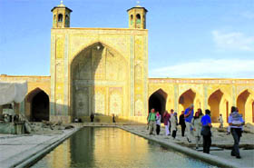 The Vakil mosque, adjacent to Vakil bazaar, with row upon symmetric row of beautiful arches and columns, its domes covered in geometrical patterns, its walls clothed in Persian calligraphy is a mesmerising sight