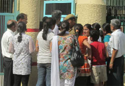 Candidates stand outside an examination centre in Bathinda after the AIEEE was cancelled and subsequently rescheduled on Sunday