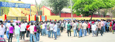 Scores of shocked and harried students from across the region wait anxiously outside Kendriya Vidyalaya, Sector 47, a venue of the AIEEE exam, on Sunday. 