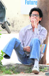A student from Chandigarh strikes a reflective pose as he sits deep in thought outside the AIEEE examination centre at Mount Carmel School, Sector 47.