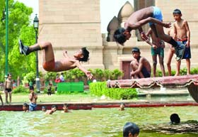 A SPLASH IN THE POOL: Children beat the heat in New Delhi on Sunday