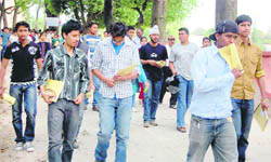 Students come out of their examination centre after appearing in the AIEEE examination in Dehradun on Sunday.