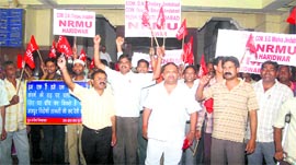 Labour union members raise slogans on May Day in Haridwar on Sunday.