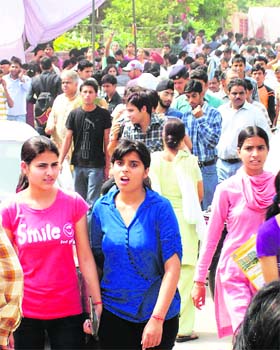 AIEEE aspirants come out of an examination centre at Kurukshetra after the entrance exam was rescheduled due to a reported paper leak on Sunday