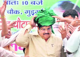 INLD secretary-general Ajay Singh Chautala being honoured with a turban at a public meeting in Gurgaon on Sunday