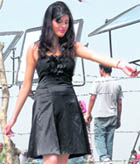 A model of an upcoming Punjabi album performs during a shoot on the banks of the Pong Dam lake near Nandpurin village in Kangra district. 
