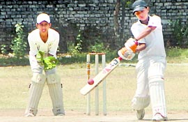 A batsman plays a shot during a match between Chandgarh and Amritsar teams at Guru Nanak Public School in Sector 36, Chandigarh, on Monday.