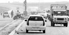 Risking lives for a shortcut, commuters drive on the wrong side near Baltana on the Panchkula-Zirakpur highway.
