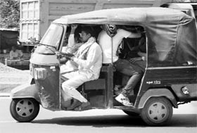An overloaded autorickshaw plies at Zirakpur.