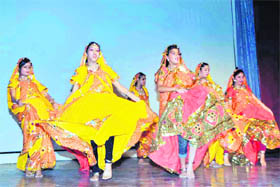 Students present a dance at the investiture ceremony of St Josephs Academy in Dehradun on Monday.