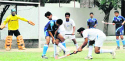A match under way in the Kandhari Memorial Hockey Tournament at Welham Boys' School in Dehradun on Monday. 