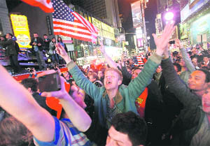 People celebrate in Times Square after the death of Osama bin Laden was announced by President Barack Obama on Monday.